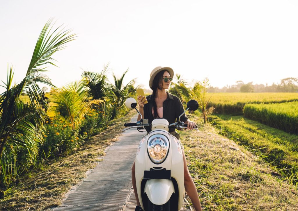 Scooter on a Bali road β cheapest transport option for expats living in Bali